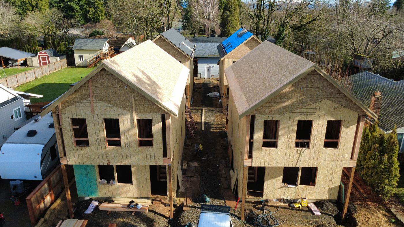 Two cottages framed and sheathed