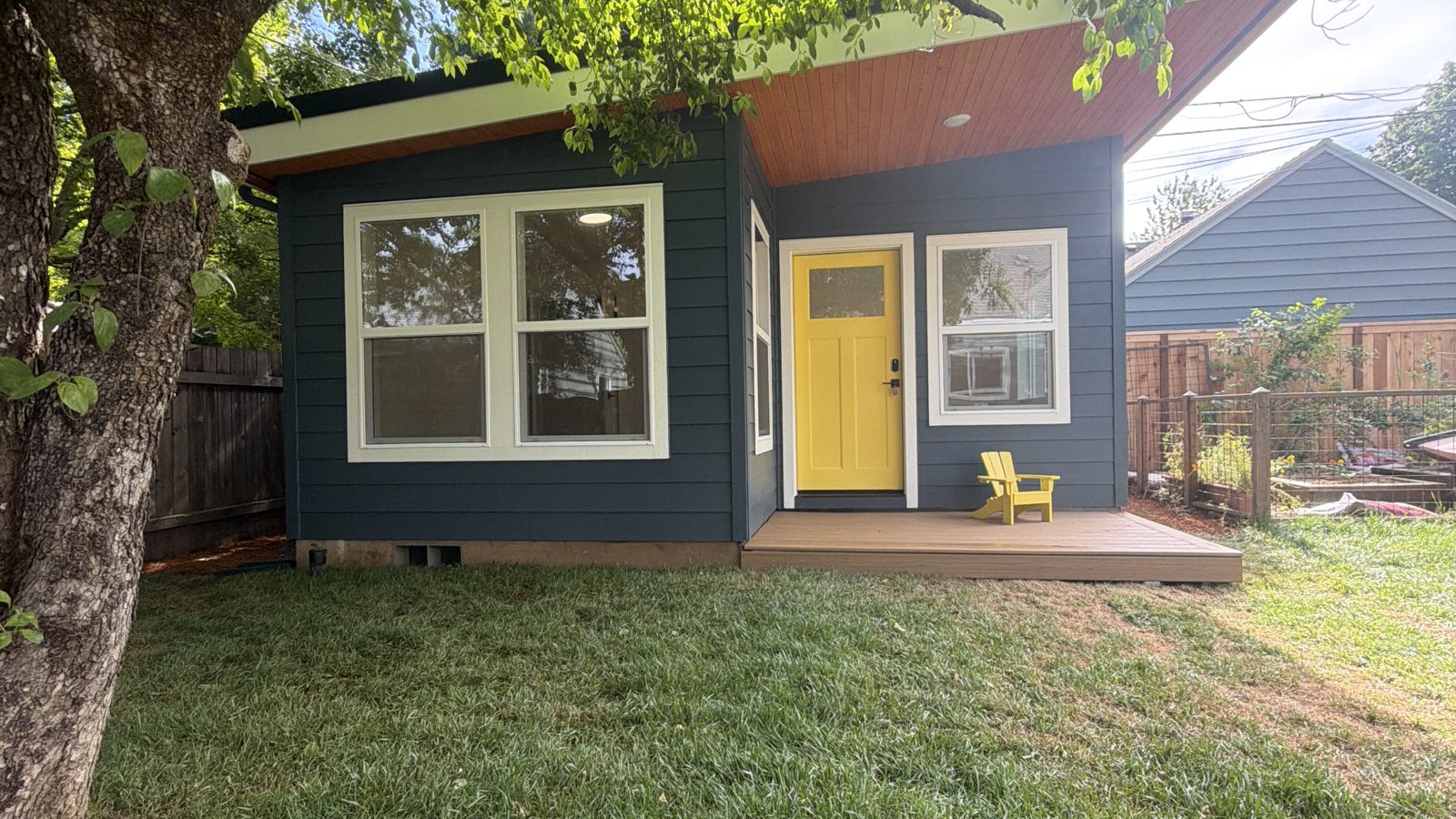 Small detached home with a covered deck