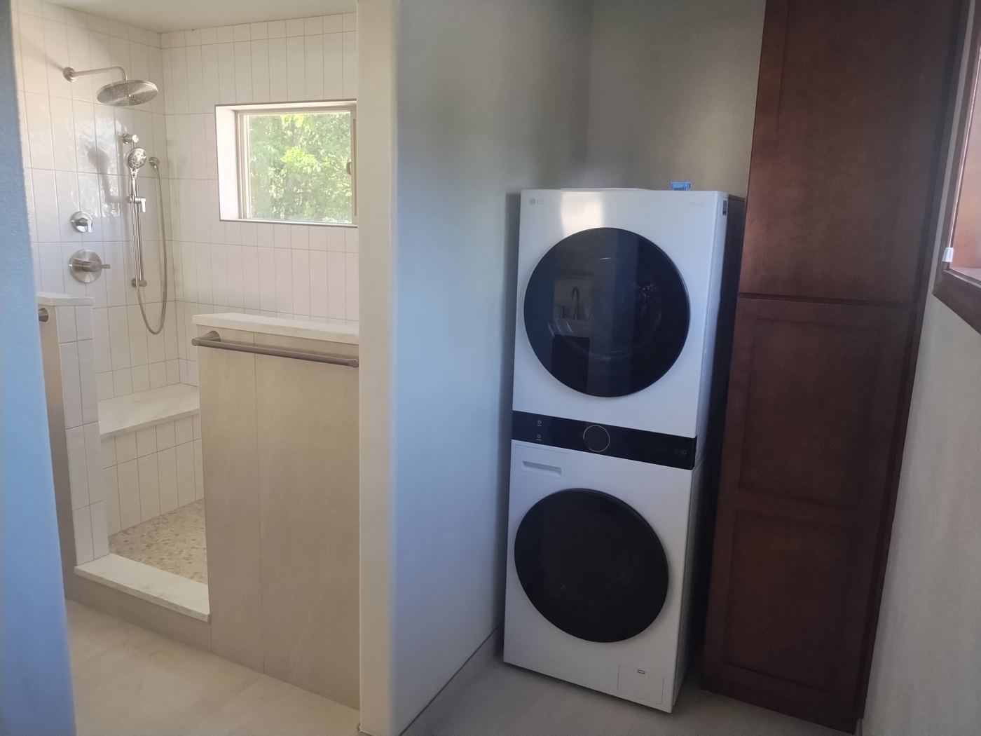 Stacked laundry beside the shower
